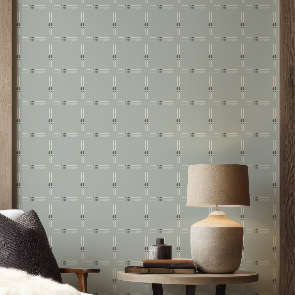 Close-up of Ski Check Sage Green Wallpaper highlighting the white ski motif, deep green bindings, and soft sage green background.