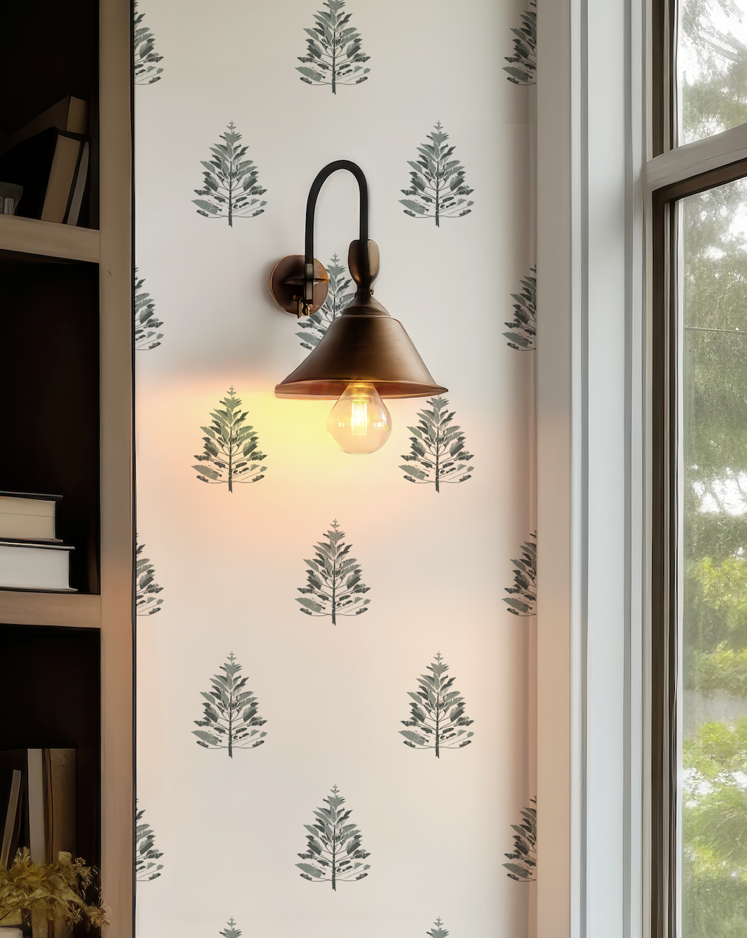 Close-up of Woodland Pine Wallpaper showing the botanical pine tree illustration in muted green against a light neutral background.